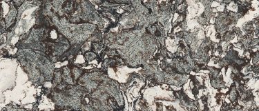 a Marwell quartz countertop surface that features a medium-toned design with a swirling pattern in gray, brown, and white