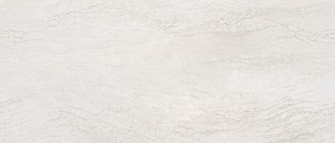 an Ironsbridge quartz countertop surface that features blends of gray, white, and cream accents over the creamy background