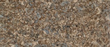 a Havergate quartz countertop surface that features swirls of gray, brown, and beige that creates a dark design