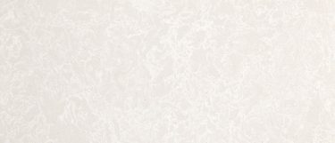 a Foggy City quartz countertop surface that features a soft cloudy white base that has subtle white dots scattered throughout