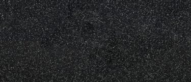 a Flint Black quartz countertop surface that features a dark design with subtle gray speckles over the black background