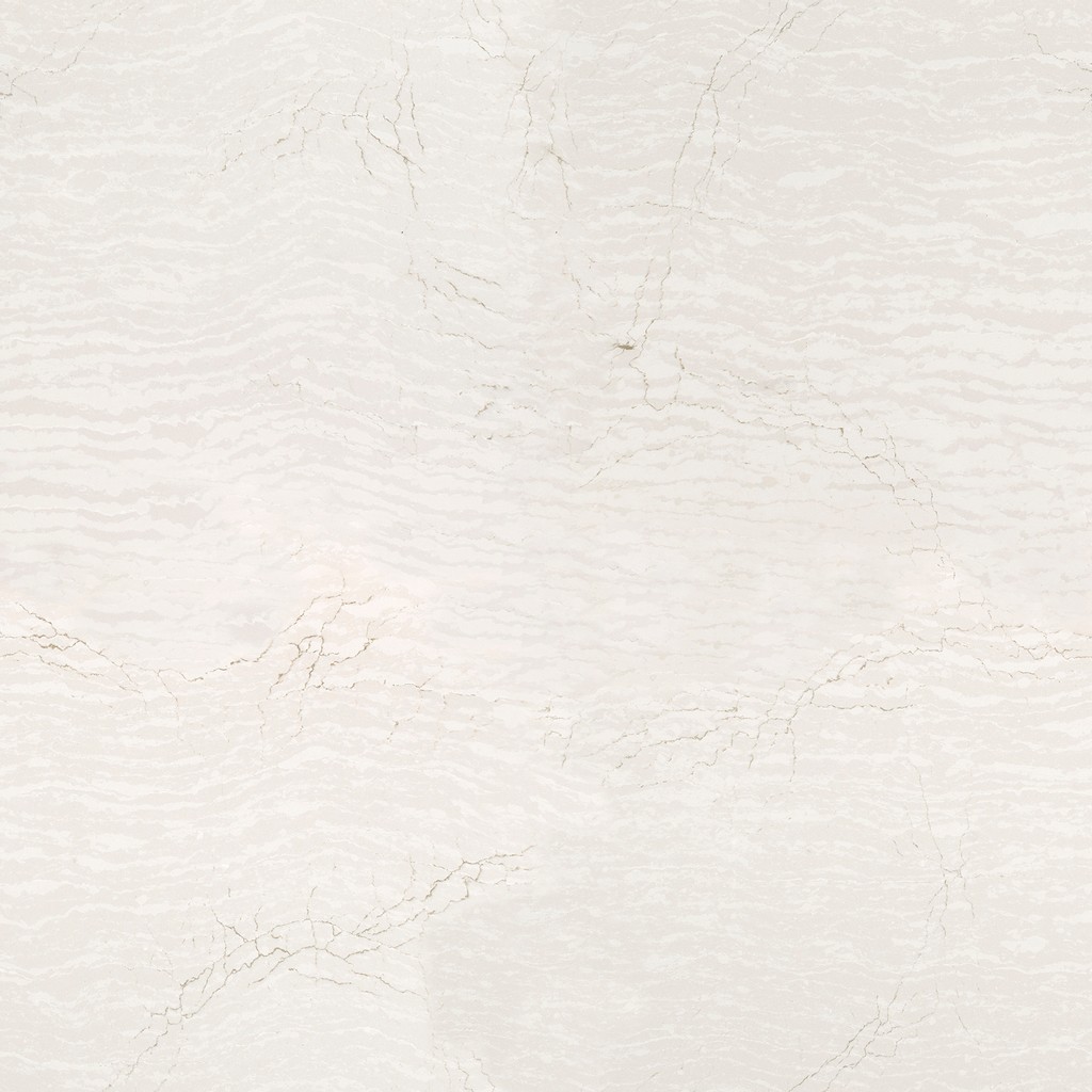 a Delgatie quartz countertop surface that has warm veining over the creamy white background