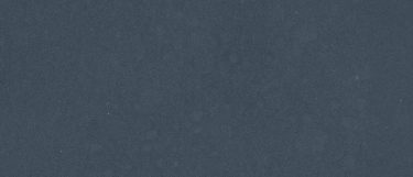 a Daron quartz countertop surface that has light sparkle spots in gold and platinum over the deep blue background