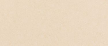 a Cuddington quartz countertop surface that features a light town or yellowish design with shades of cream