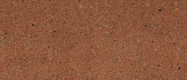 a Chatham quartz countertop surface that features a medium tone design with speckle patterns in brown, white, cream, and black over the copper red background