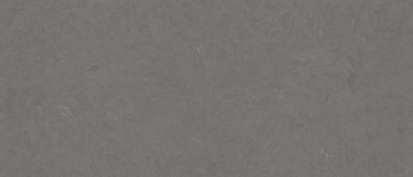 a Carrick quartz countertop surface that features a medium gray design with subtle light and dark gray details