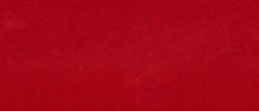 a Cardigan Red quartz countertop surface tht features a bold red color with delicate speckles throughout