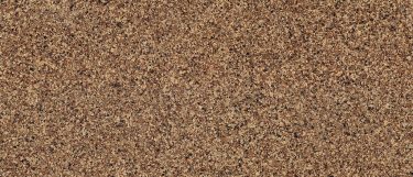 a Brownhill quartz countertop surface that blends colors of black, brown, cream, and charcoal with white speckles