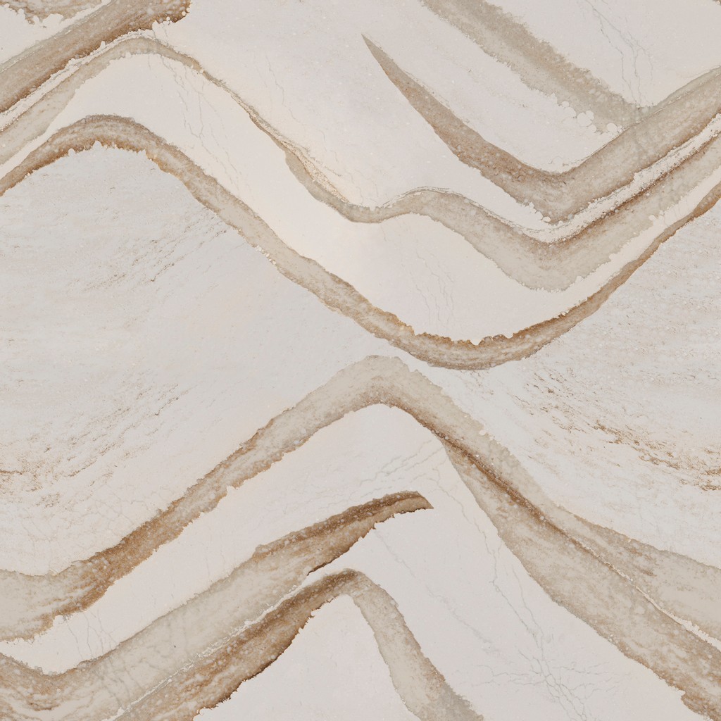 a Brittanicca Gold quartz countertop surface that features ash veins and charcoal speckles over the creamy marble background