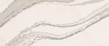 a Brittanicca quartz countertop surface that has a neutral white color with gray veins with charcoal speckles
