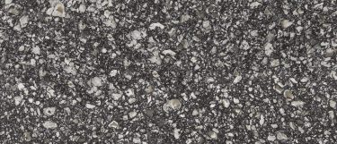 a Braemar quartz countertop surface that features a dark design with with whites and creams with gray swirling details