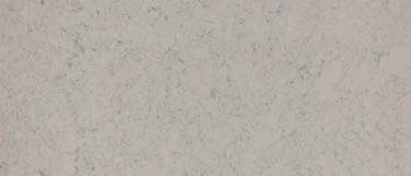 a Bradwell quartz countertop surface that features delicate dark gray strands and cluster details over the medium gray background