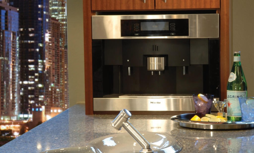 605c4dab53ad0e68de5871b2_bradford_3 an oven and a tray of alcoholic beverage over the Bradford countertop surface