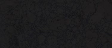 a Black Rock quartz countertop surface that has a dark design with subtle patterns in gray and charcoal gray