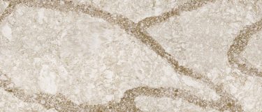 a Beaumont quartz countertop surface that features thick veins over the bold design of white on the light brown background