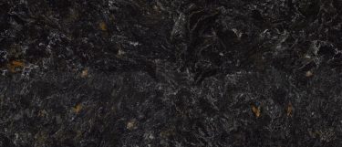 an Armitage quartz countertop surface that features a blend of gray and black swirls with cream and white details