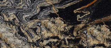 an orinoco granite countertop surface that features veining pattern in white, copper, and gold over the dark background