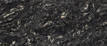 an Indian Black granite countertop surface that has swirling pattern in gold and cream over the black background
