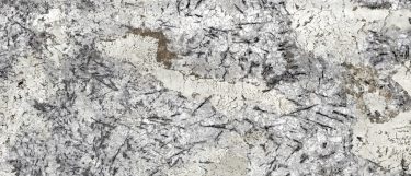 an Ice Blue granite countertop surface that features blue and black accent over the white background