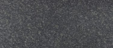 a Graphite Grey granite countertop surface that features granule pattern in black, silver, and white