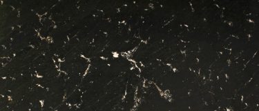 a via lattea granite countertop surface that has a black base with white linear streak veins