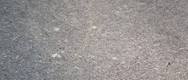 a silver blue granite countertop surface that blends gray and blue tones in speckling pattern