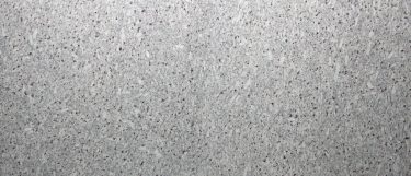 a Luna Blanca granite countertop surface that features gray tones over the moon white background