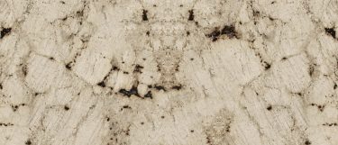 a Crescent Veil granite countertop surface that features rich cream with thick brown veins