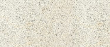 a Crema Pearl granite countertop surface that has a beige color with charcoal and gray details