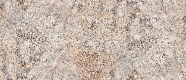 a Caroline Summer granite countertop surface that features yellow and brown colors with white highlights