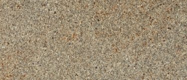 a Blat granite countertop surface that features dots in gray and black over the cream background