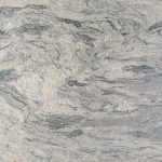 a stone countertop surface with swirls of grays and whites