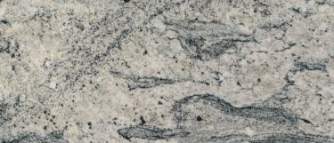 a white wave granite countertop that has dark veins over the light gray background