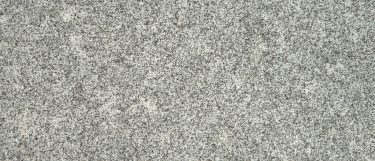 a white sparkle granite countertop that features cool white tones and gray undertones that are emphasized by a faint sparkle and specks