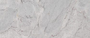 a stream white granite countertop surface that features gray veining pattern across its warm white base