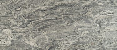 a silver creek granite countertop surface that features gray tones in a wavy swirl pattern