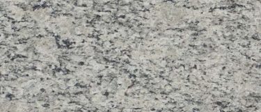 a Santa Cecilia granite countertop surface that blends colors of cream, white, and black