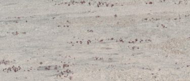a river white granite countertop surface that has a white base with shades of blue, cream, and gray in veining pattern