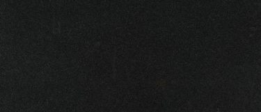 a black countertop surface with subtle speckles