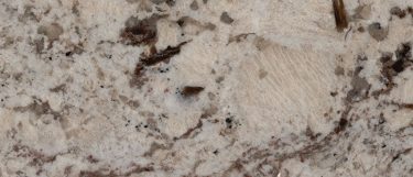 a Nevasca Mist granite countertop surface that blends together the colors of grays and beiges in a veining pattern
