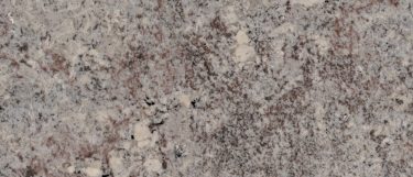 a mystic spring granite countertop surface that has a dominant gray color because of its dramatic veining pattern in gray and black over the soft white background