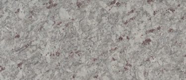 a moon white granite countertop surface that has specks and flecks of burgundy throughout the white stone