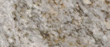 a Makalu Bay countertop surface that has a beige background with speckle design in black, brown, and rust
