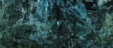 a Lemurian Blue granite countertop surface that has rich shades of blue, green, black, and turquoise