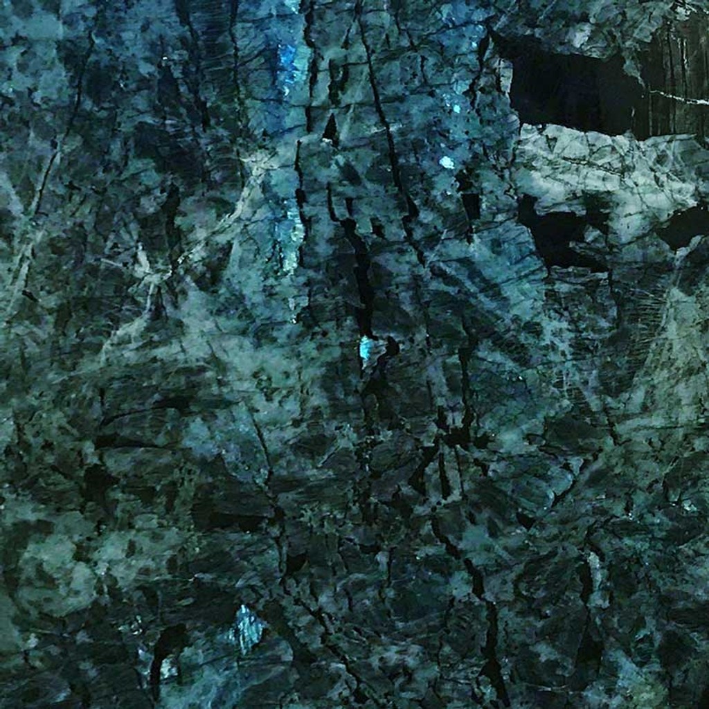 a Lemurian Blue granite countertop surface that has rich shades of blue, green, black, and turquoise