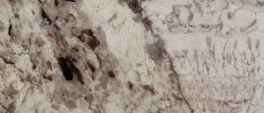 a Kalix River granite countertop surface that blends the colors of creams, white, pinks, and browns in its design