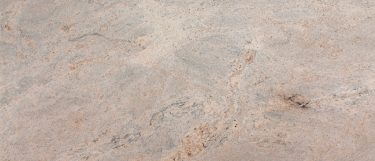 an Ivory Fantasy granite countertop that features eggshell and vanilla hues throughout the surface