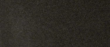 an Impala Black granite countertop surface that has white dots over the dark gray black background