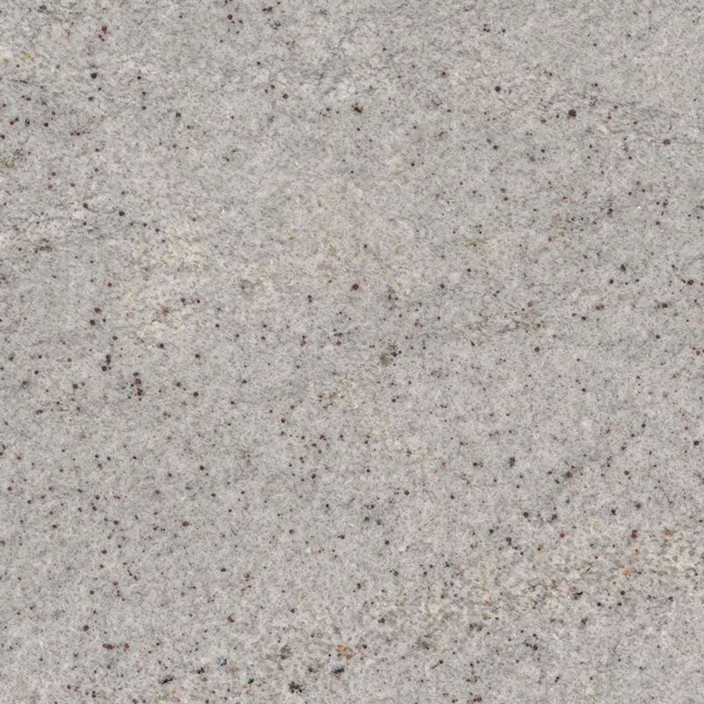 a Himalayan White granite countertop surface that has a cool white background with dark gray speckles throughout