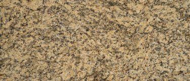 a Giallo Rio granite countertop surface that features grays and golds with dark veining pattern